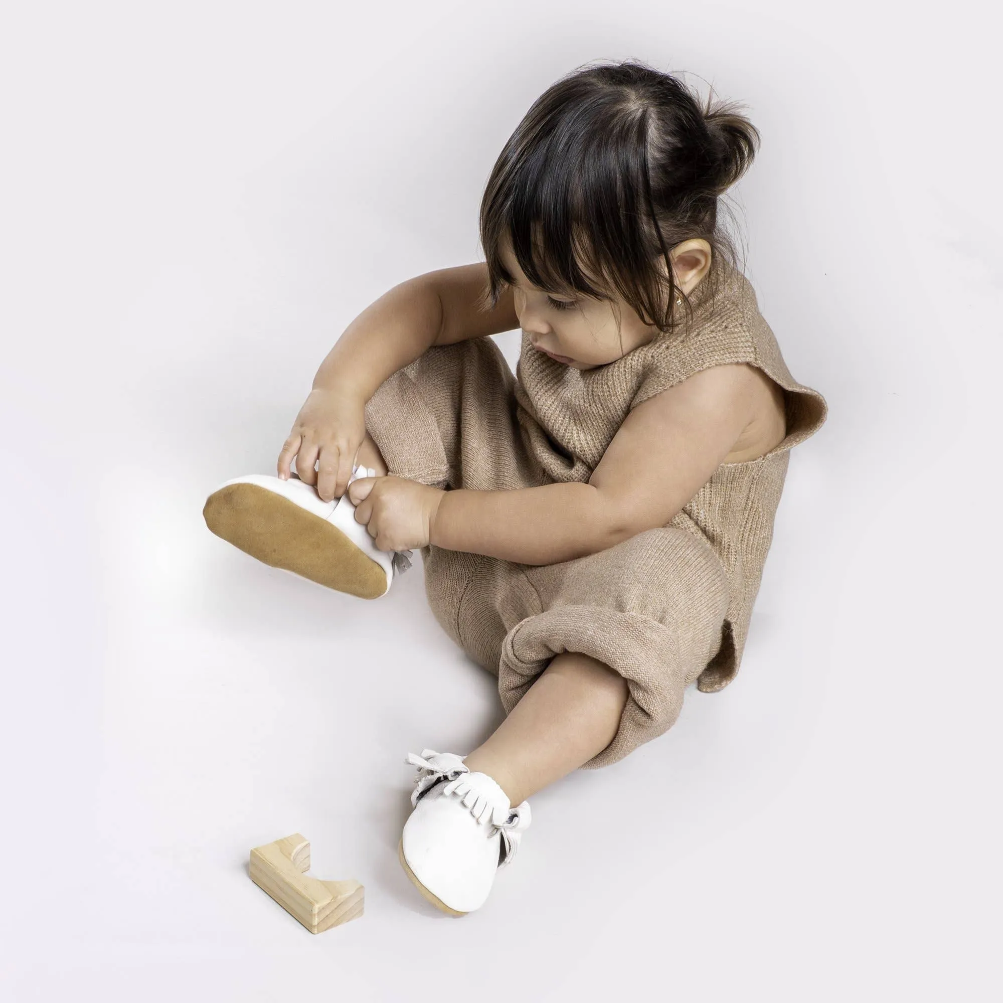 baby moccasins in white